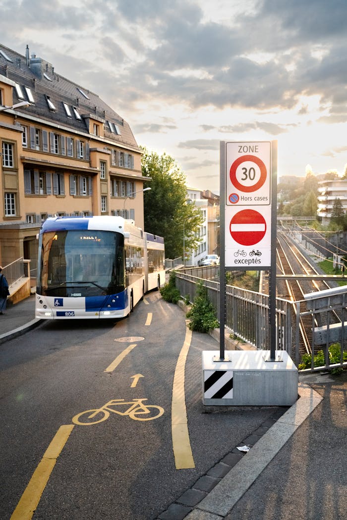 A bus driving down a street next to a bike lane