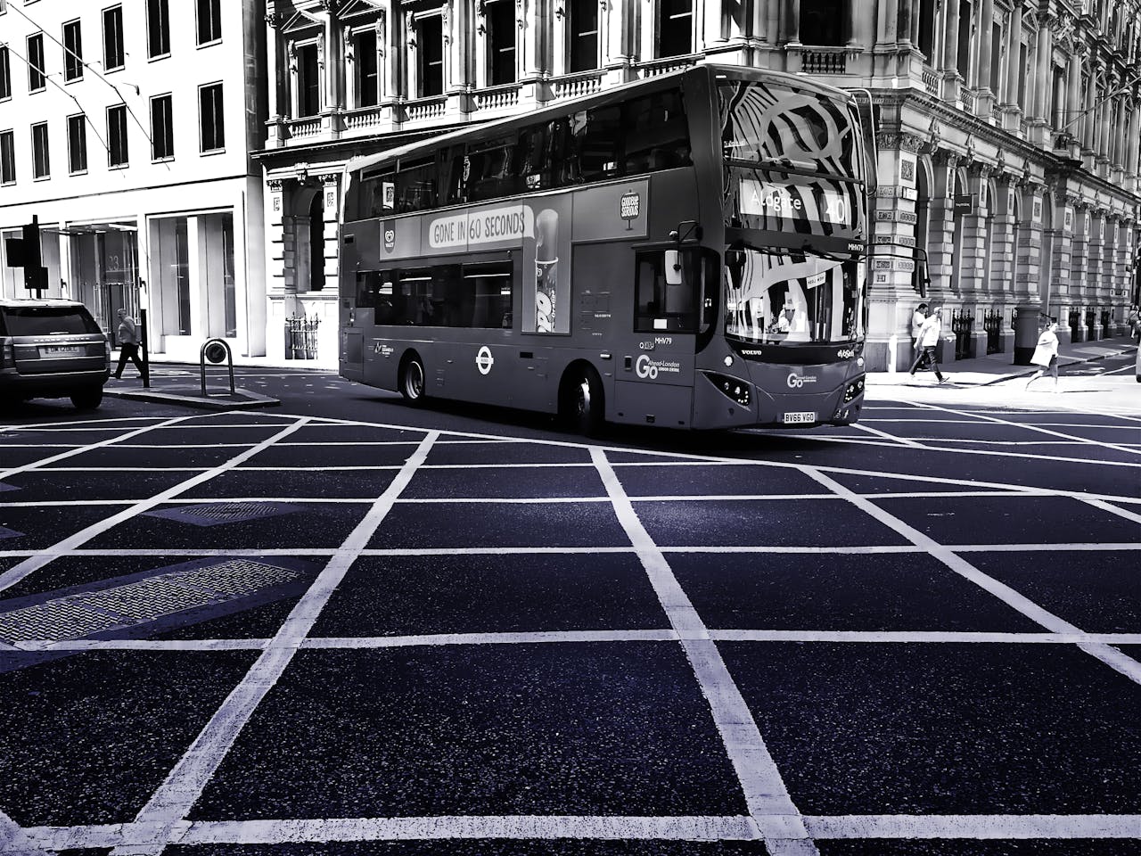 Grayscale Photo of Double Decker Bus on Road